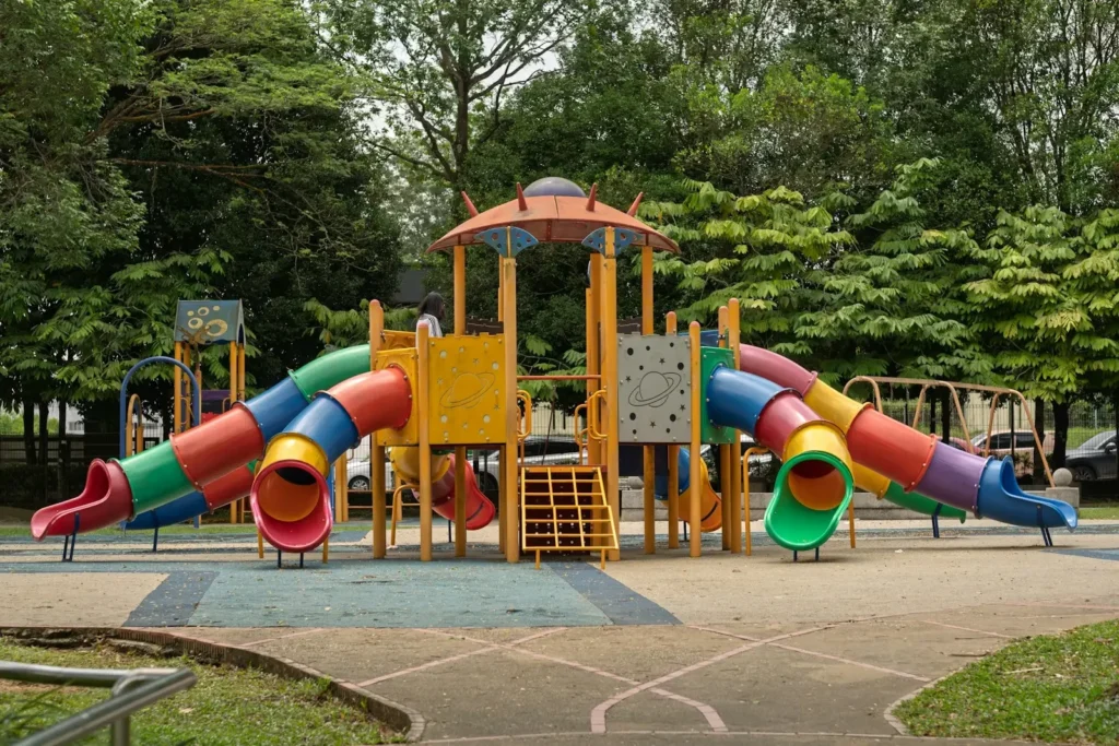 Colorful playground with slides and climbing structures