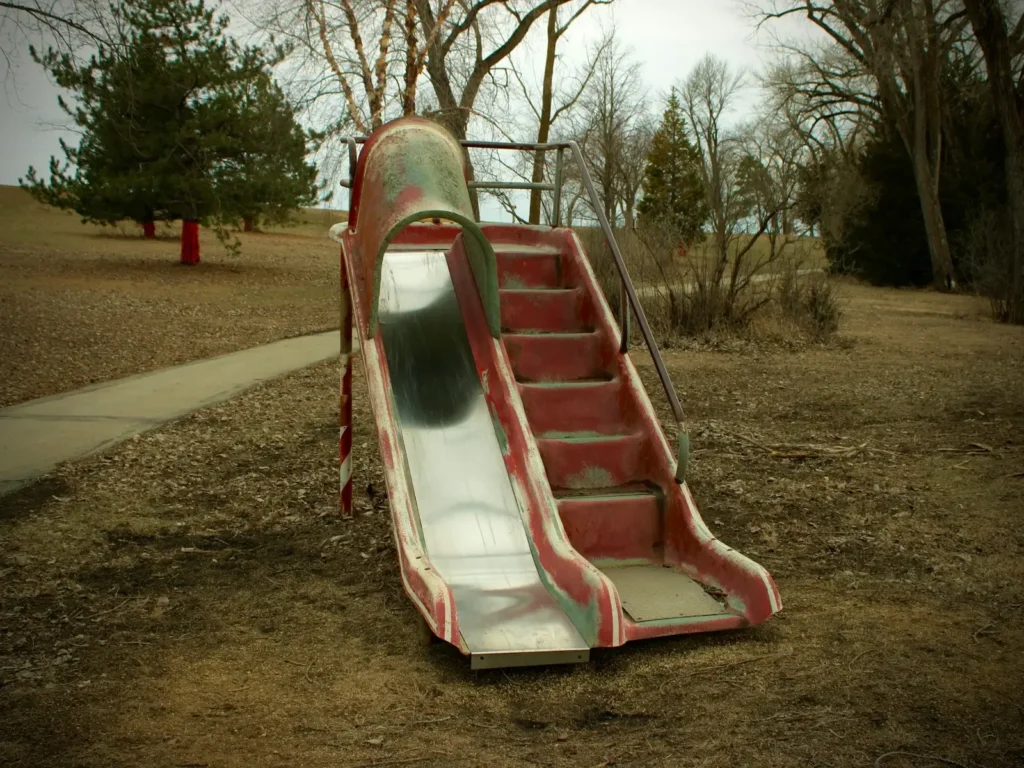 An old metal slide in a park