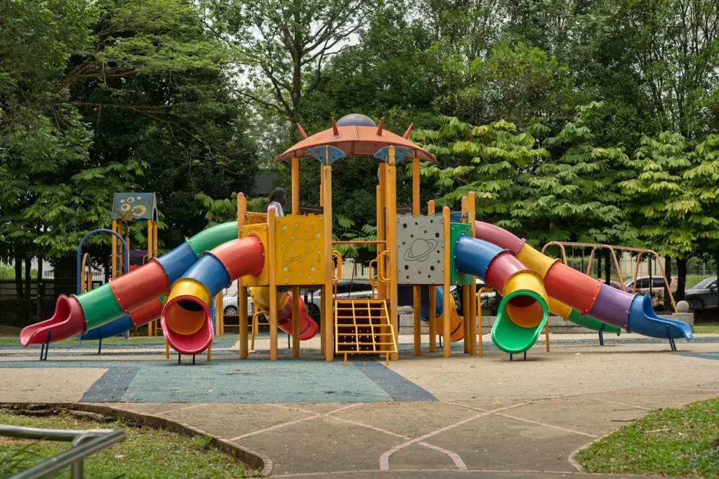 Colorful playground with slides and climbing structures