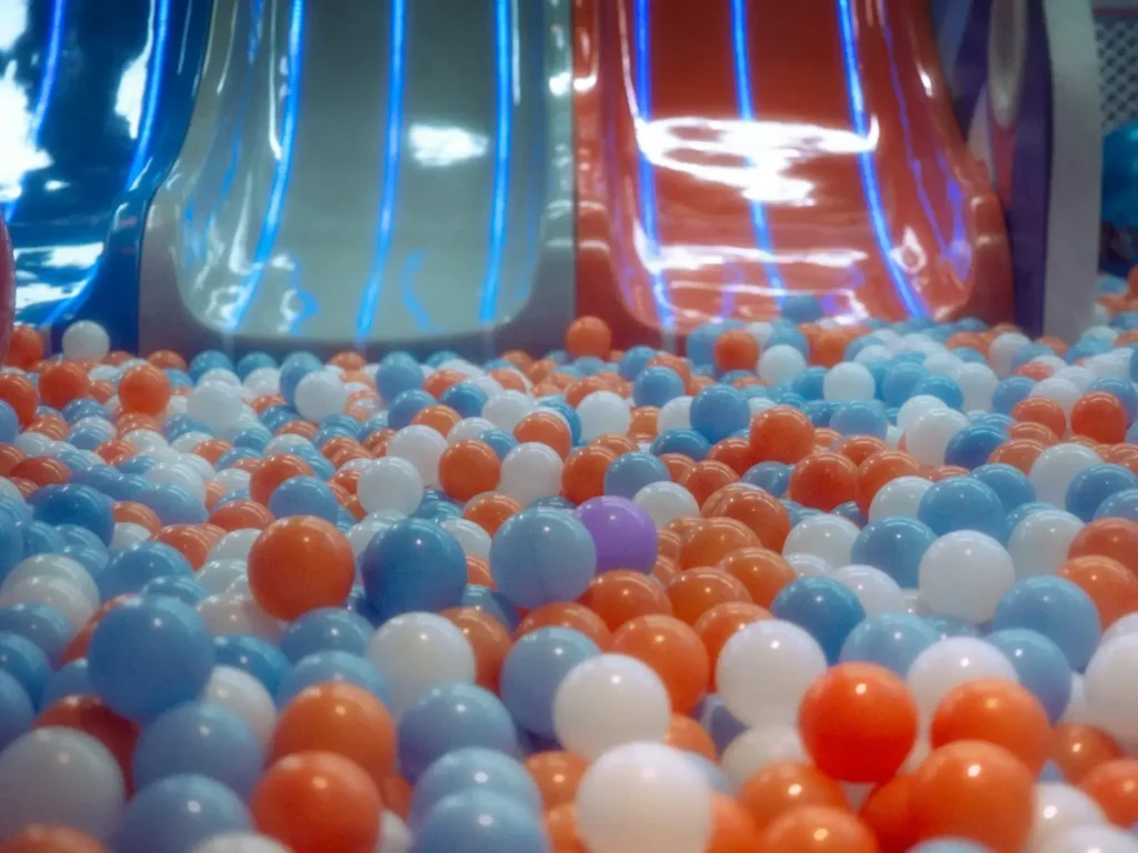 A bunch of balls that are in a pool